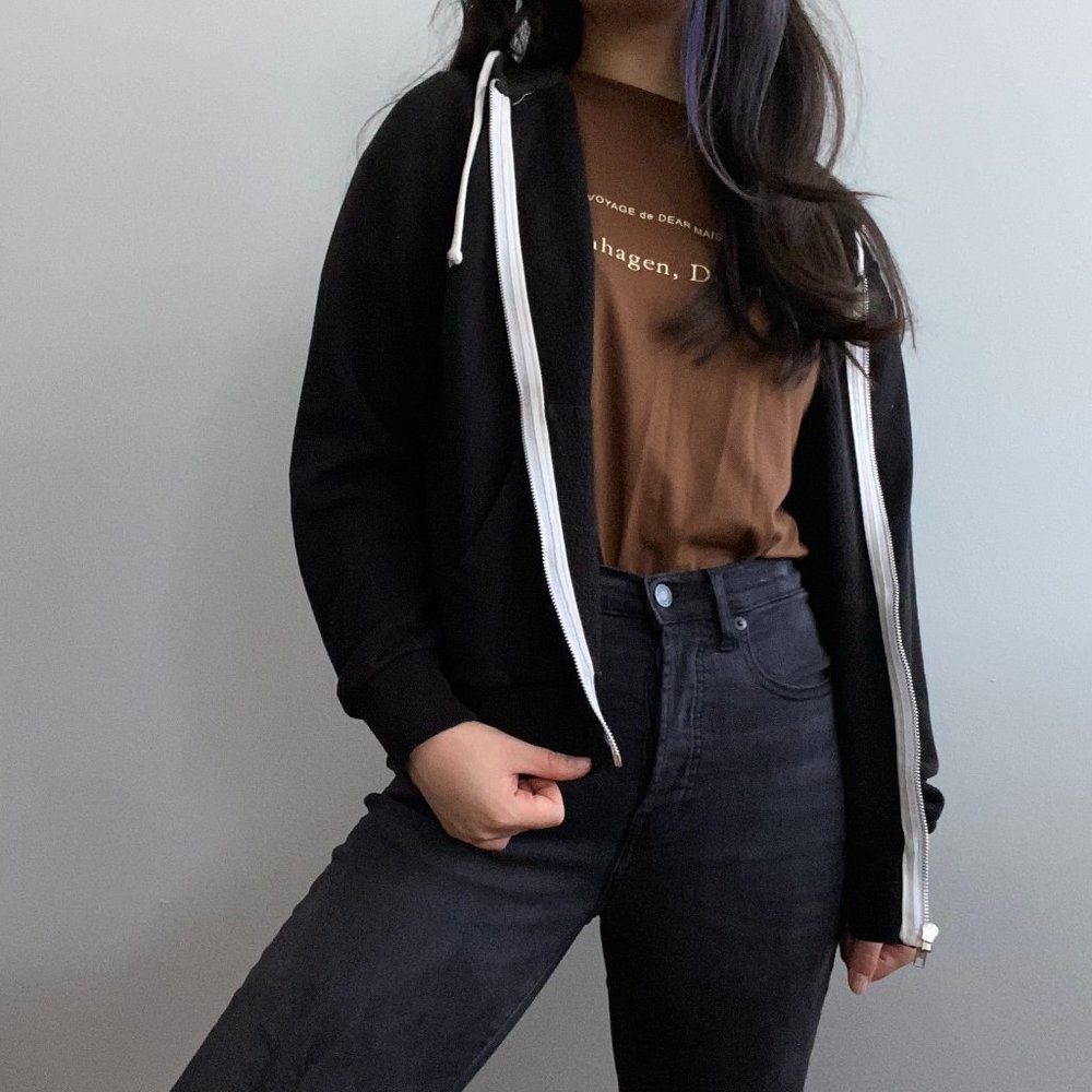 Black Hoodie with Zipper and White Accents.